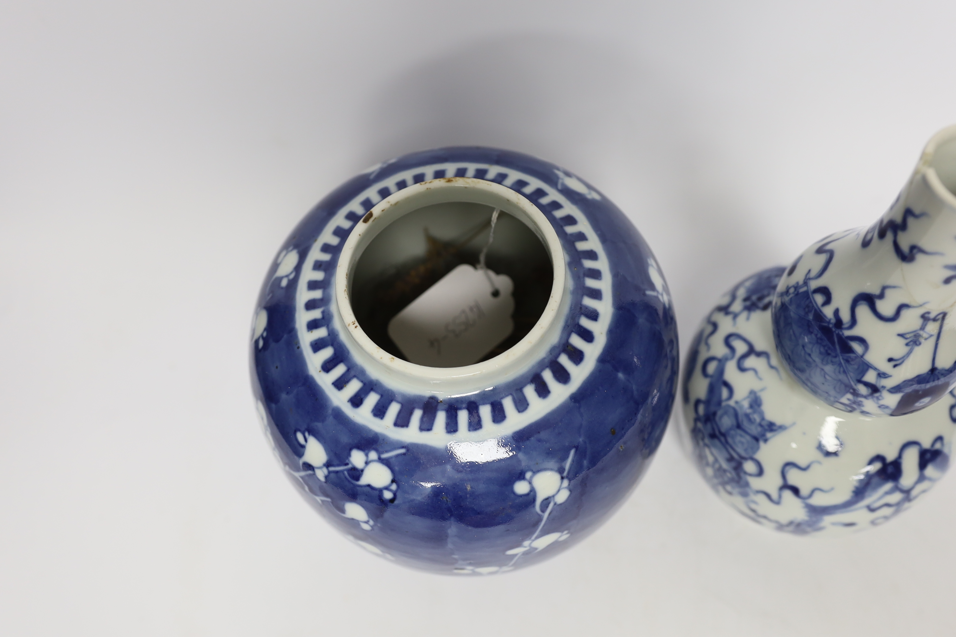 A Chinese blue and white prunus jar and cover and a double gourd vase, late 19th/early20th century, tallest 23cm